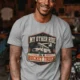Bucket Truck T-Shirt - “My Other Ride Is A Bucket Truck” Utility Crew/Electrician Tee — athletic-heather t-shirt, model photo | Pressure Tested Co