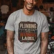 Plumbing Warning Label T-Shirt — Funny Plumber Shirt — athletic-heather t-shirt, model photo | Pressure Tested Co