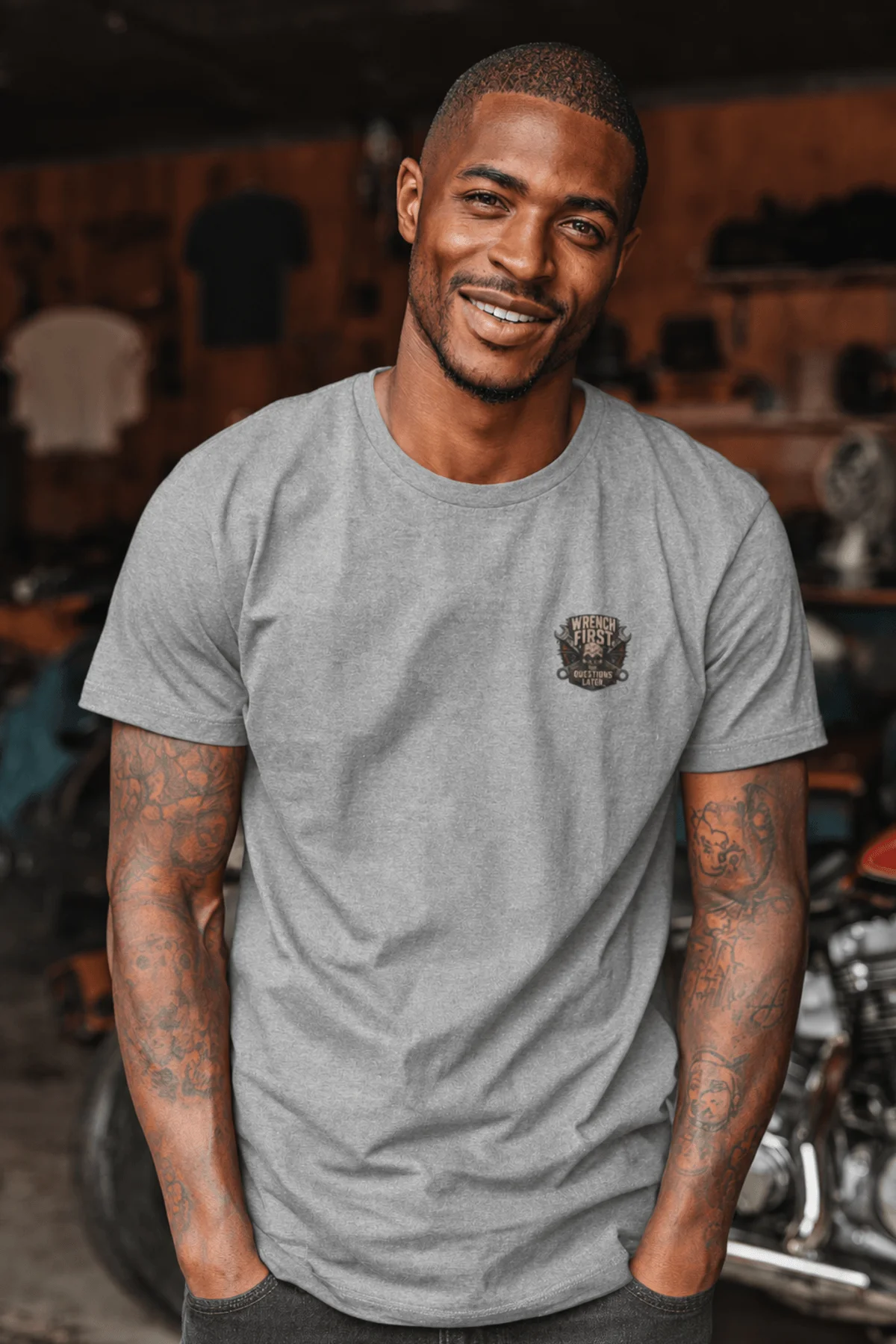 Wrench First Tee — "Wrench First, Questions Later" Mechanic Skull T-Shirt — athletic-heather t-shirt, model photo | Pressure Tested Co