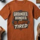 Grounded, Bonded and Slightly Tired Graphic Tee — Funny Electrical Worker Shirt — autumn t-shirt, flat-lay product photo | Pressure Tested Co