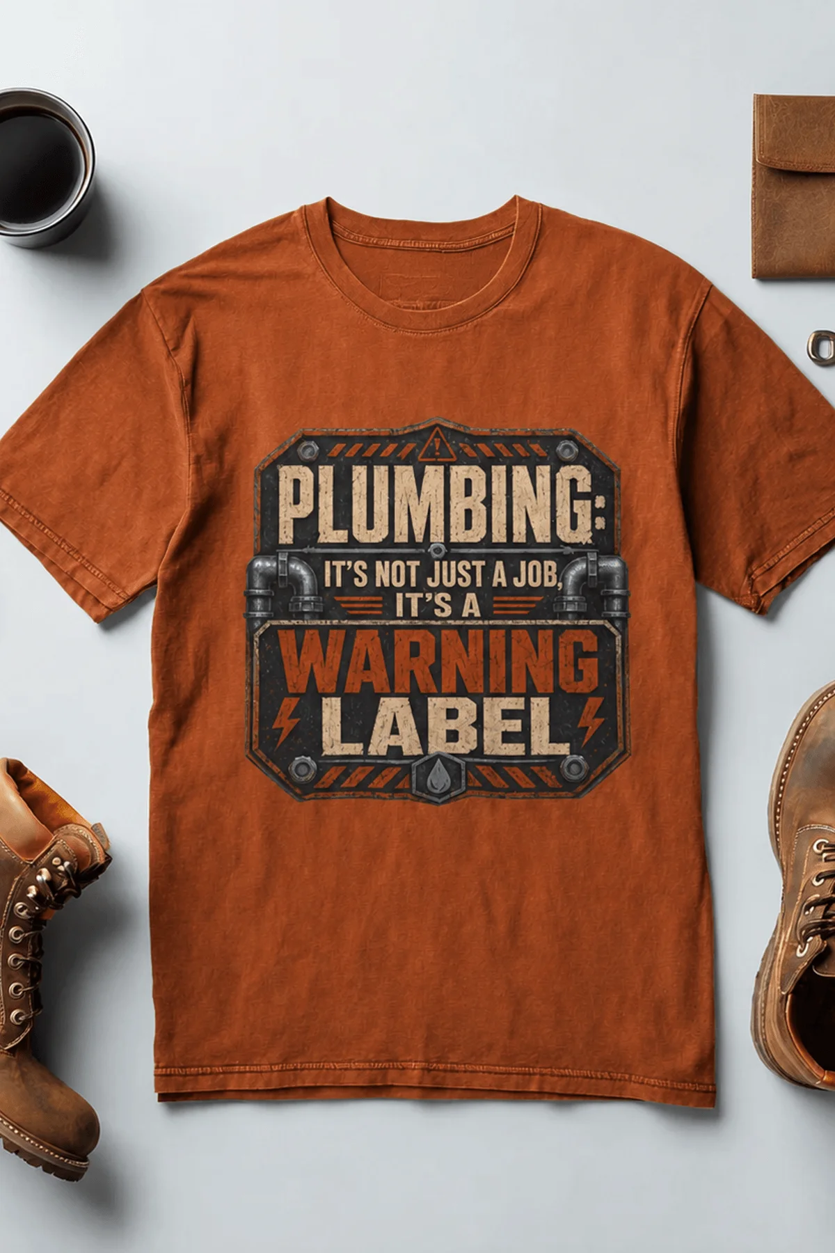 Plumbing Warning Label T-Shirt — Funny Plumber Shirt — autumn t-shirt, flat-lay product photo | Pressure Tested Co