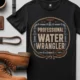 Funny Plumber Tee - "Professional Water Wrangler" Rustic Rope Graphic T-Shirt — black t-shirt, flat-lay product photo | Pressure Tested Co