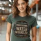Funny Plumber Tee - "Professional Water Wrangler" Rustic Rope Graphic T-Shirt — blue-spruce t-shirt, model photo | Pressure Tested Co