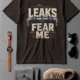 Leaks Fear Me T-Shirt - Funny Plumber Pipes Tee — brown t-shirt, flat-lay product photo | Pressure Tested Co