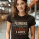 Plumbing Warning Label T-Shirt — Funny Plumber Shirt — brown t-shirt, model photo | Pressure Tested Co