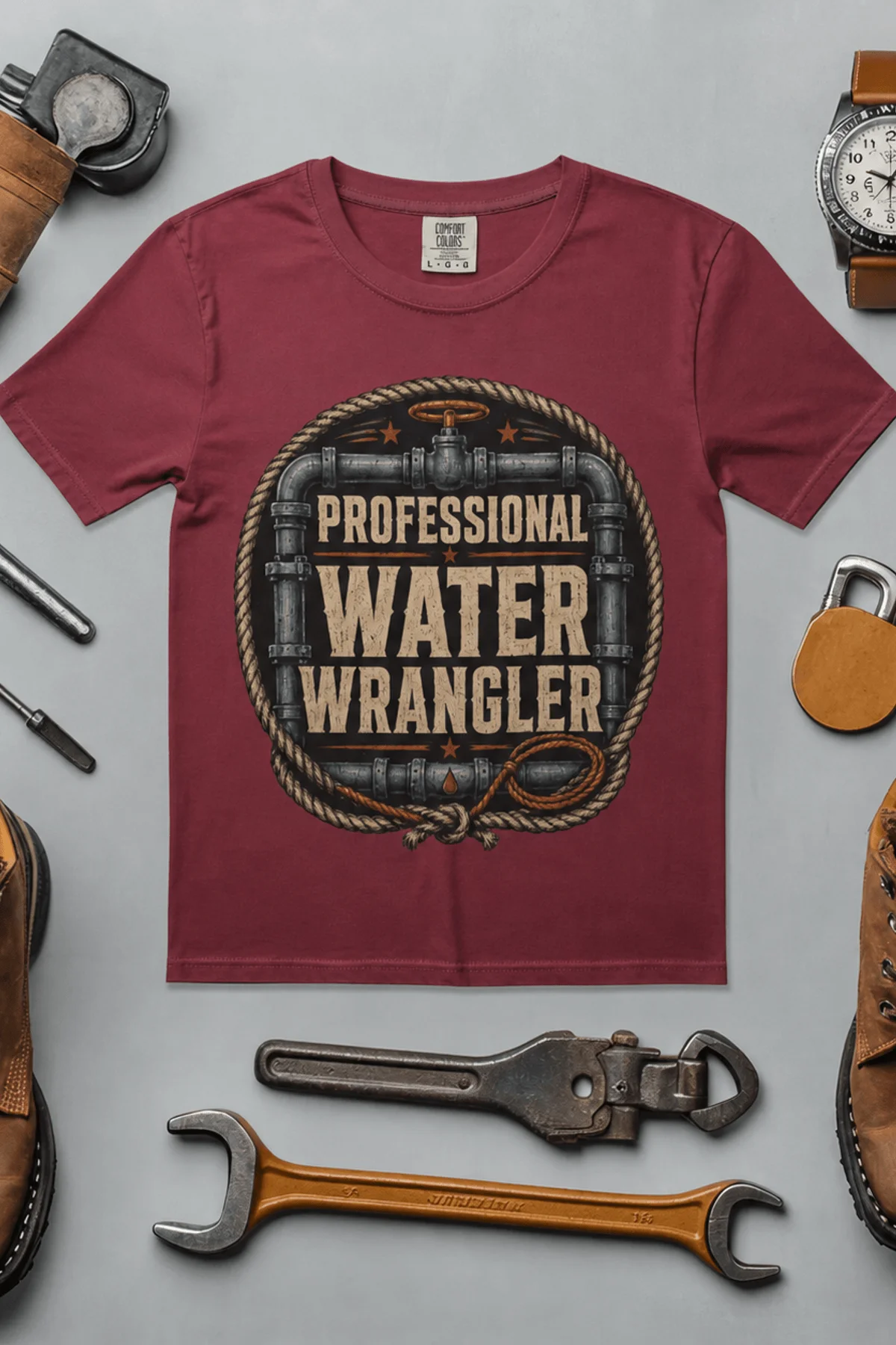 Funny Plumber Tee - "Professional Water Wrangler" Rustic Rope Graphic T-Shirt — chili t-shirt, flat-lay product photo | Pressure Tested Co