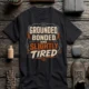 Grounded, Bonded and Slightly Tired Graphic Tee — Funny Electrical Worker Shirt — dark-grey t-shirt, flat-lay product photo | Pressure Tested Co