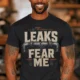 Leaks Fear Me T-Shirt - Funny Plumber Pipes Tee — dark-grey t-shirt, model photo | Pressure Tested Co