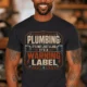 Plumbing Warning Label T-Shirt — Funny Plumber Shirt — dark-grey t-shirt, model photo | Pressure Tested Co