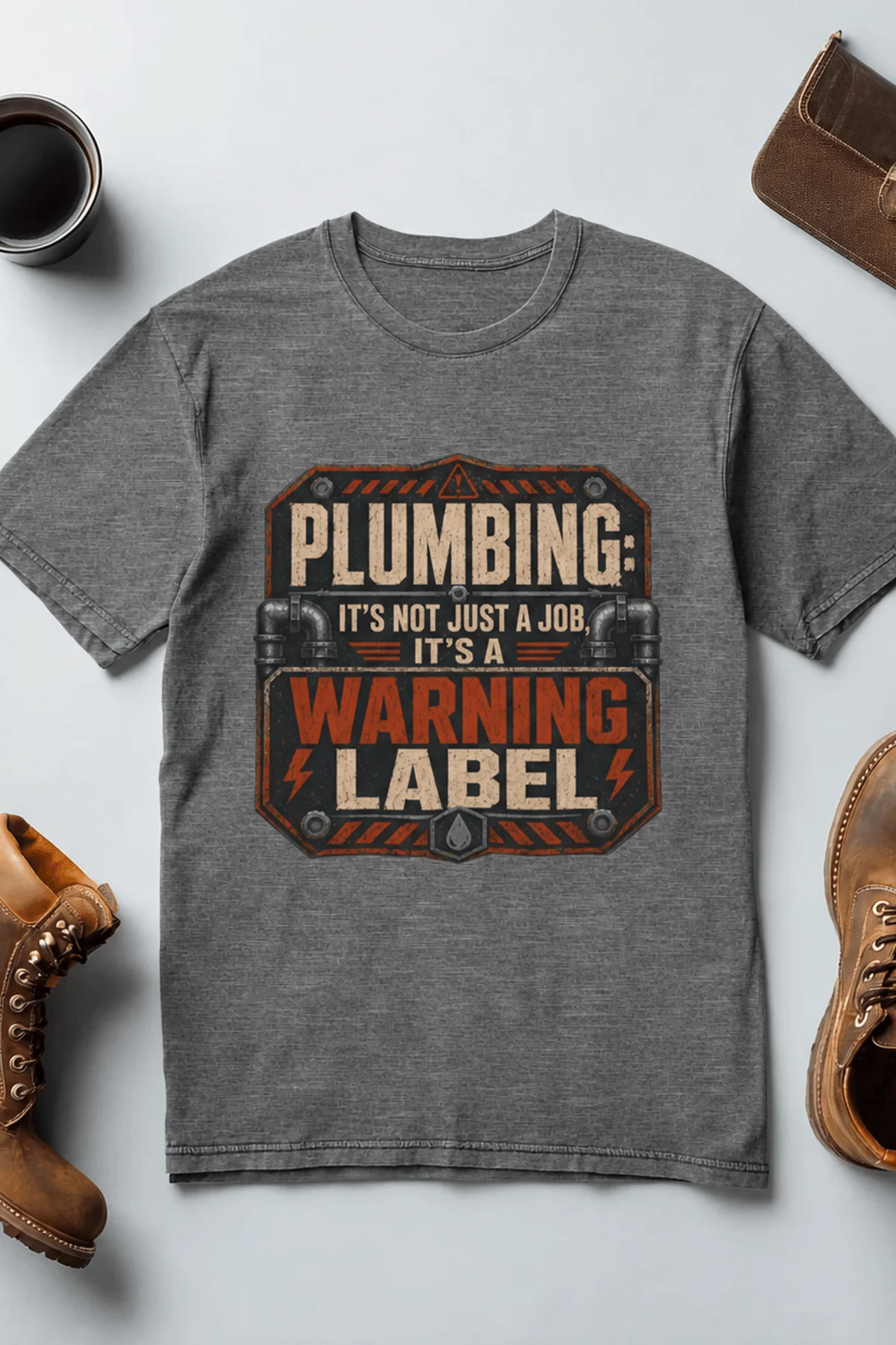 Plumbing Warning Label T-Shirt — Funny Plumber Shirt — deep-heather t-shirt, flat-lay product photo | Pressure Tested Co