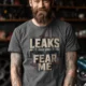Leaks Fear Me T-Shirt - Funny Plumber Pipes Tee — deep-heather t-shirt, model photo | Pressure Tested Co
