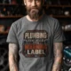 Plumbing Warning Label T-Shirt — Funny Plumber Shirt — deep-heather t-shirt, model photo | Pressure Tested Co
