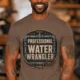Funny Plumber Tee - "Professional Water Wrangler" Rustic Rope Graphic T-Shirt — espresso t-shirt, model photo | Pressure Tested Co