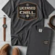 Funny HVAC Tee - "Licensed To Chill" HVAC Technician T-Shirt — graphite t-shirt, flat-lay product photo | Pressure Tested Co