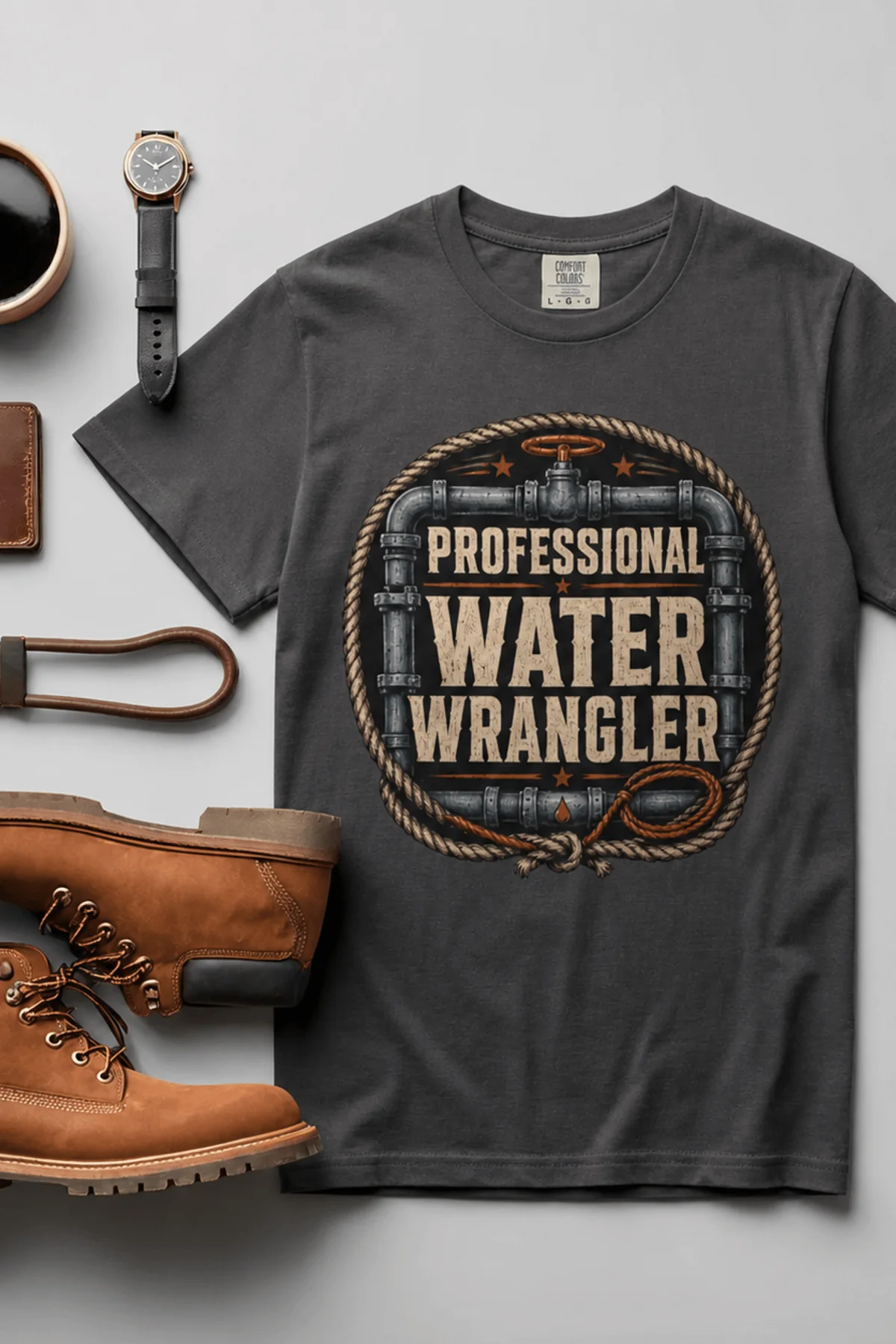 Funny Plumber Tee - "Professional Water Wrangler" Rustic Rope Graphic T-Shirt — graphite t-shirt, flat-lay product photo | Pressure Tested Co