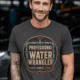 Funny Plumber Tee - "Professional Water Wrangler" Rustic Rope Graphic T-Shirt — graphite t-shirt, model photo | Pressure Tested Co