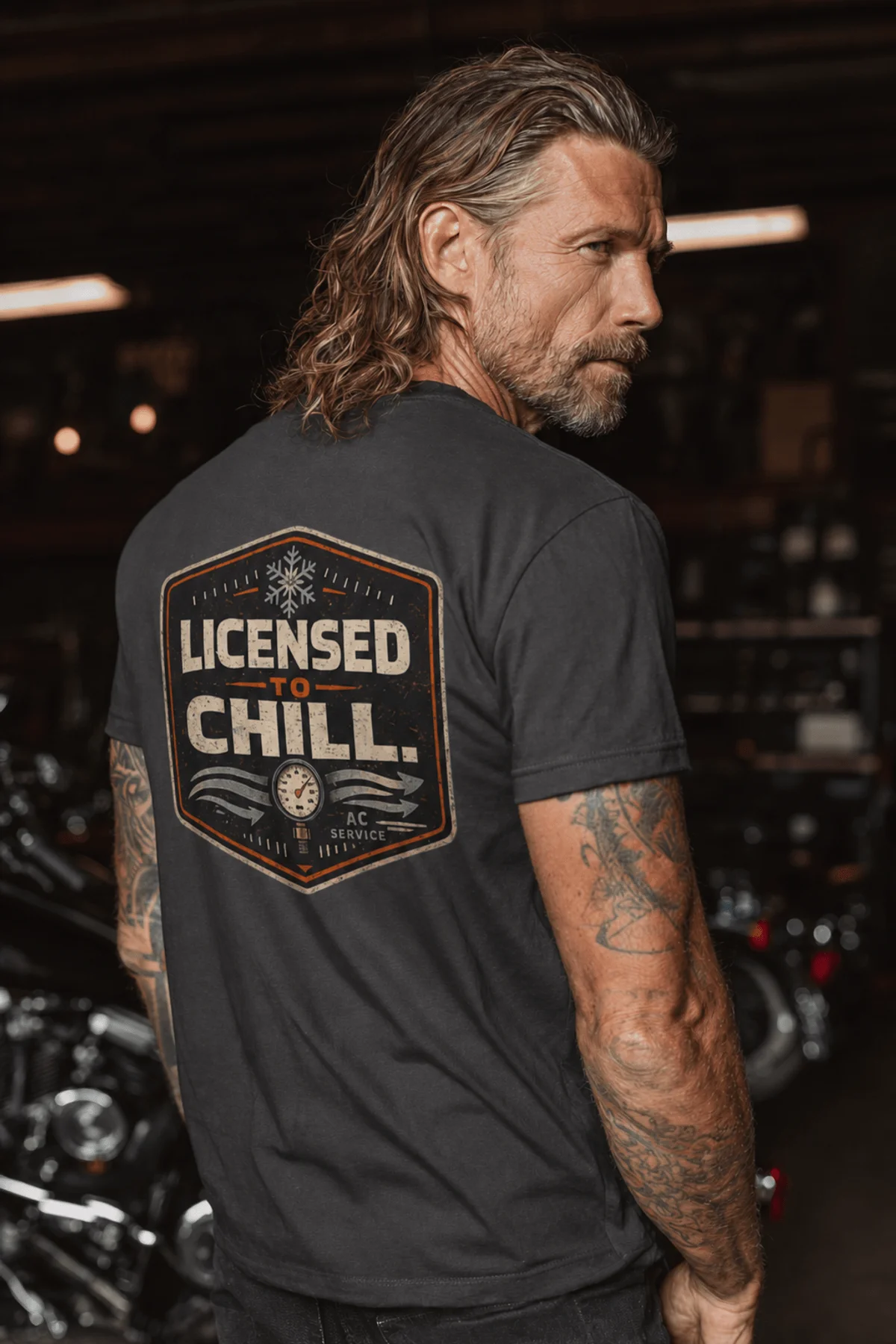 Funny HVAC Tee - "Licensed To Chill" HVAC Technician T-Shirt — graphite t-shirt, model photo | Pressure Tested Co