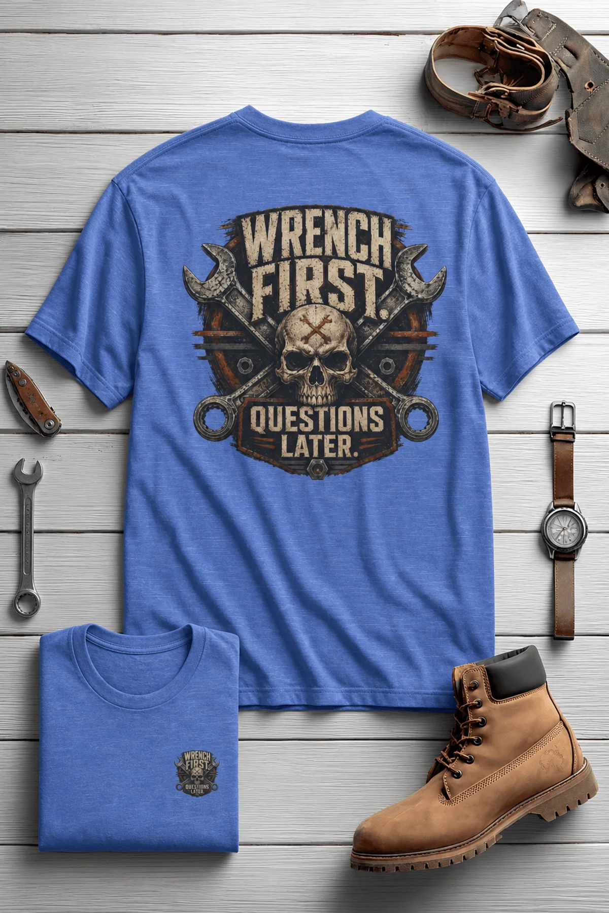 Wrench First Tee — "Wrench First, Questions Later" Mechanic Skull T-Shirt — heather-columbia-blue t-shirt, flat-lay product photo | Pressure Tested Co