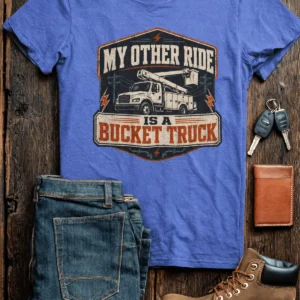 Bucket Truck T-Shirt - “My Other Ride Is A Bucket Truck” Utility Crew/Electrician Tee — heather-columbia-blue t-shirt, flat-lay product photo | Pressure Tested Co