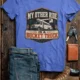 Bucket Truck T-Shirt - “My Other Ride Is A Bucket Truck” Utility Crew/Electrician Tee — heather-columbia-blue t-shirt, flat-lay product photo | Pressure Tested Co
