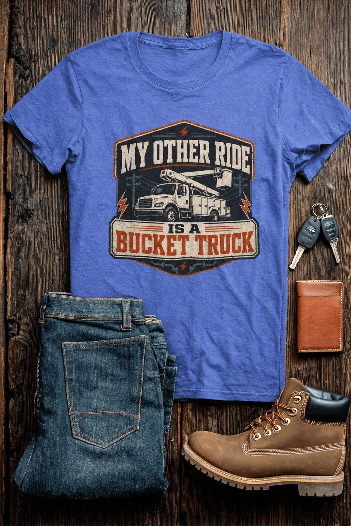 Bucket Truck T-Shirt - “My Other Ride Is A Bucket Truck” Utility Crew/Electrician Tee — heather-columbia-blue t-shirt, flat-lay product photo | Pressure Tested Co