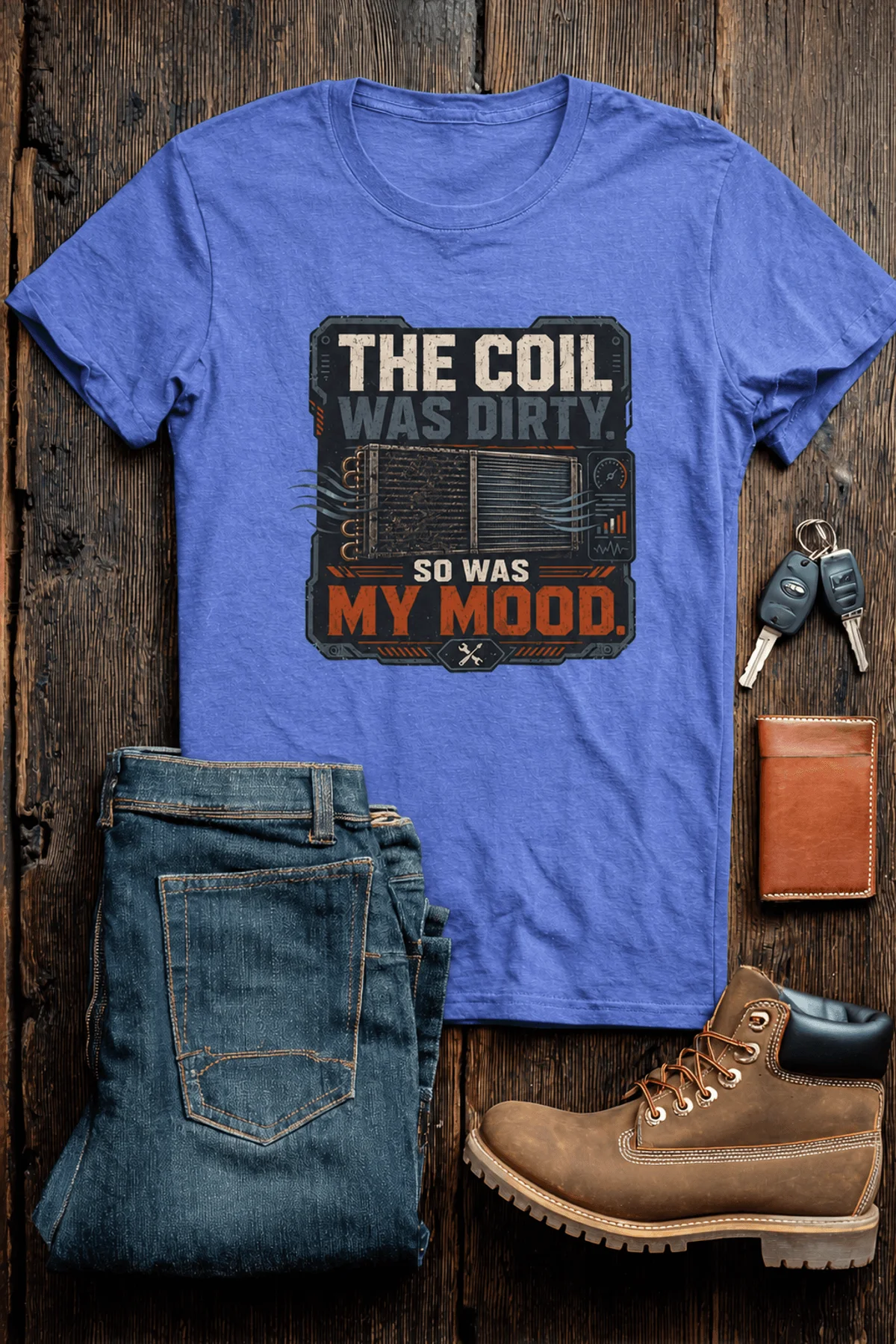 HVAC Technician Tee — “THE COIL WAS DIRTY. SO WAS MY MOOD.” — heather-columbia-blue — Flat-lay HVAC Technician Tee — “THE COIL WAS DIRTY. SO WAS MY MOOD.” — heather-columbia-blue t-shirt, flat-lay product photo | Pressure Tested Co