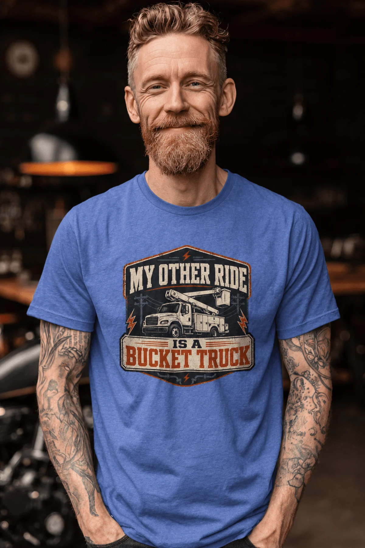 Bucket Truck T-Shirt - “My Other Ride Is A Bucket Truck” Utility Crew/Electrician Tee — heather-columbia-blue t-shirt, model photo | Pressure Tested Co