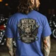 Wrench First Tee — "Wrench First, Questions Later" Mechanic Skull T-Shirt — heather-columbia-blue t-shirt, model photo | Pressure Tested Co