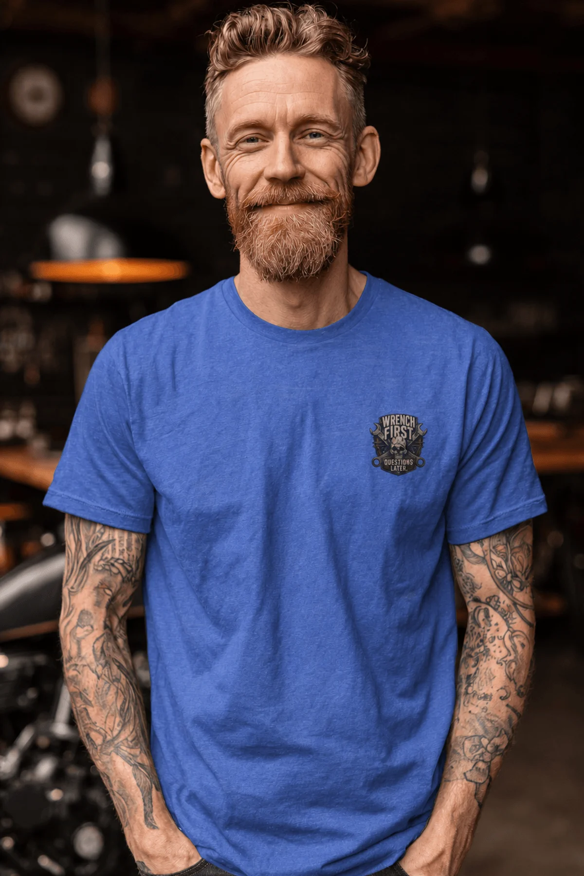 Wrench First Tee — "Wrench First, Questions Later" Mechanic Skull T-Shirt — heather-columbia-blue t-shirt, model photo | Pressure Tested Co