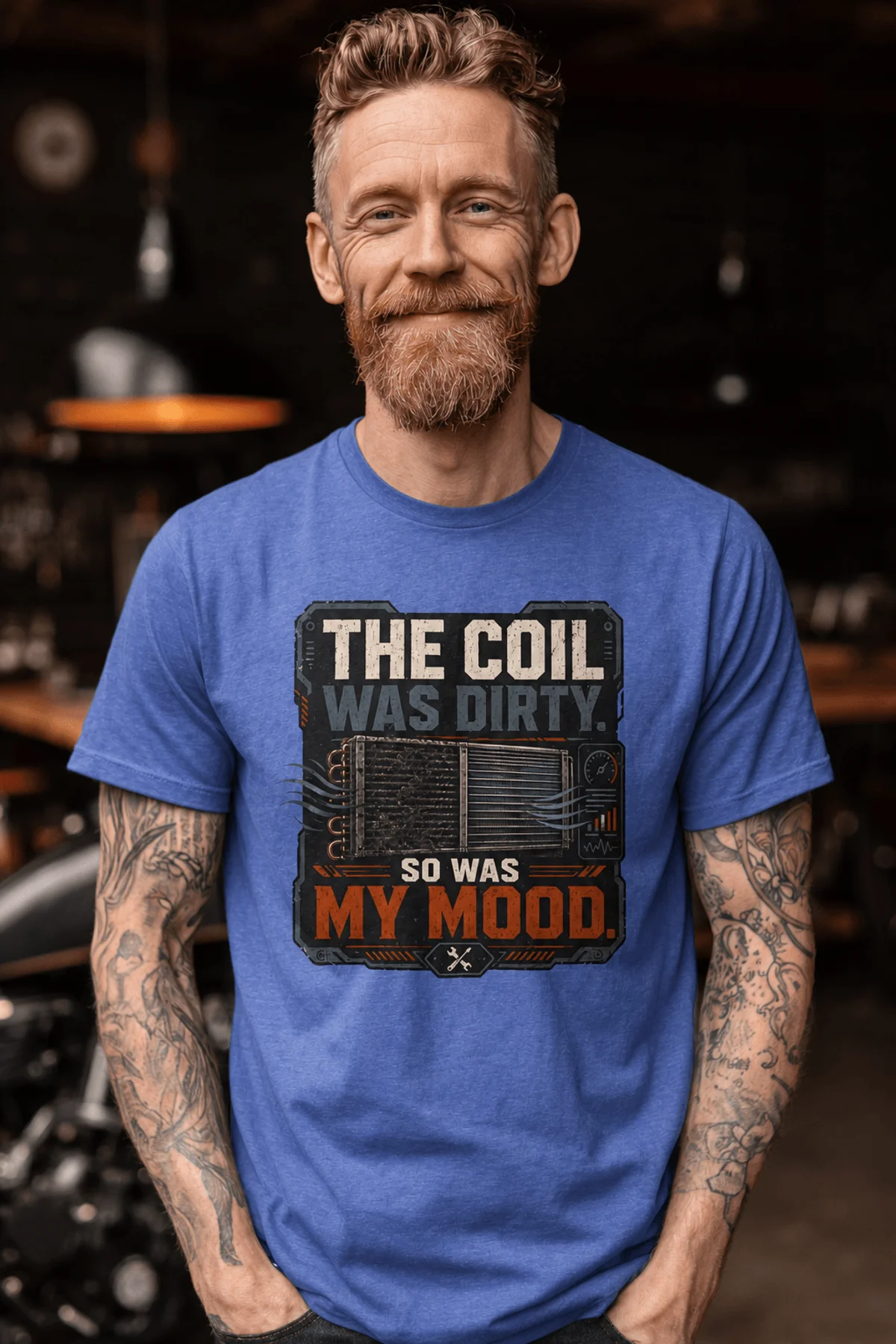 HVAC Technician Tee — “THE COIL WAS DIRTY. SO WAS MY MOOD.” — heather-columbia-blue — Model HVAC Technician Tee — “THE COIL WAS DIRTY. SO WAS MY MOOD.” — heather-columbia-blue t-shirt, model photo | Pressure Tested Co