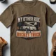 Bucket Truck T-Shirt - “My Other Ride Is A Bucket Truck” Utility Crew/Electrician Tee — heather-olive t-shirt, flat-lay product photo | Pressure Tested Co