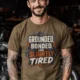 Grounded, Bonded and Slightly Tired Graphic Tee — Funny Electrical Worker Shirt — heather-olive t-shirt, model photo | Pressure Tested Co