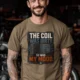 HVAC Technician Tee — “THE COIL WAS DIRTY. SO WAS MY MOOD.” — heather-olive — Model HVAC Technician Tee — “THE COIL WAS DIRTY. SO WAS MY MOOD.” — heather-olive t-shirt, model photo | Pressure Tested Co
