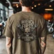 Wrench First Tee — "Wrench First, Questions Later" Mechanic Skull T-Shirt — heather-olive t-shirt, model photo | Pressure Tested Co