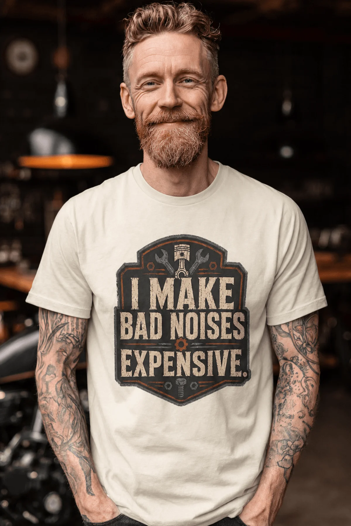 Funny Mechanic Tee - "I Make Bad Noises Expensive" Technician Worker/ Mechanic / Gearhead Tee — ivory t-shirt, model photo | Pressure Tested Co