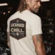 Funny HVAC Tee - "Licensed To Chill" HVAC Technician T-Shirt — ivory t-shirt, model photo | Pressure Tested Co