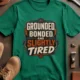 Grounded, Bonded and Slightly Tired Graphic Tee — Funny Electrical Worker Shirt — kelly t-shirt, flat-lay product photo | Pressure Tested Co