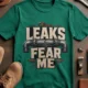 Leaks Fear Me T-Shirt - Funny Plumber Pipes Tee — kelly t-shirt, flat-lay product photo | Pressure Tested Co