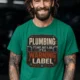 Plumbing Warning Label T-Shirt — Funny Plumber Shirt — kelly t-shirt, model photo | Pressure Tested Co
