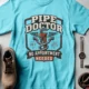 Plumber T-Shirt — "Pipe Doctor. No Appointment Needed" Vintage Work Shirt — lagoon-blue — Flat-lay Plumber T-Shirt — "Pipe Doctor. No Appointment Needed" Vintage Work Shirt — lagoon-blue t-shirt, flat-lay product photo | Pressure Tested Co