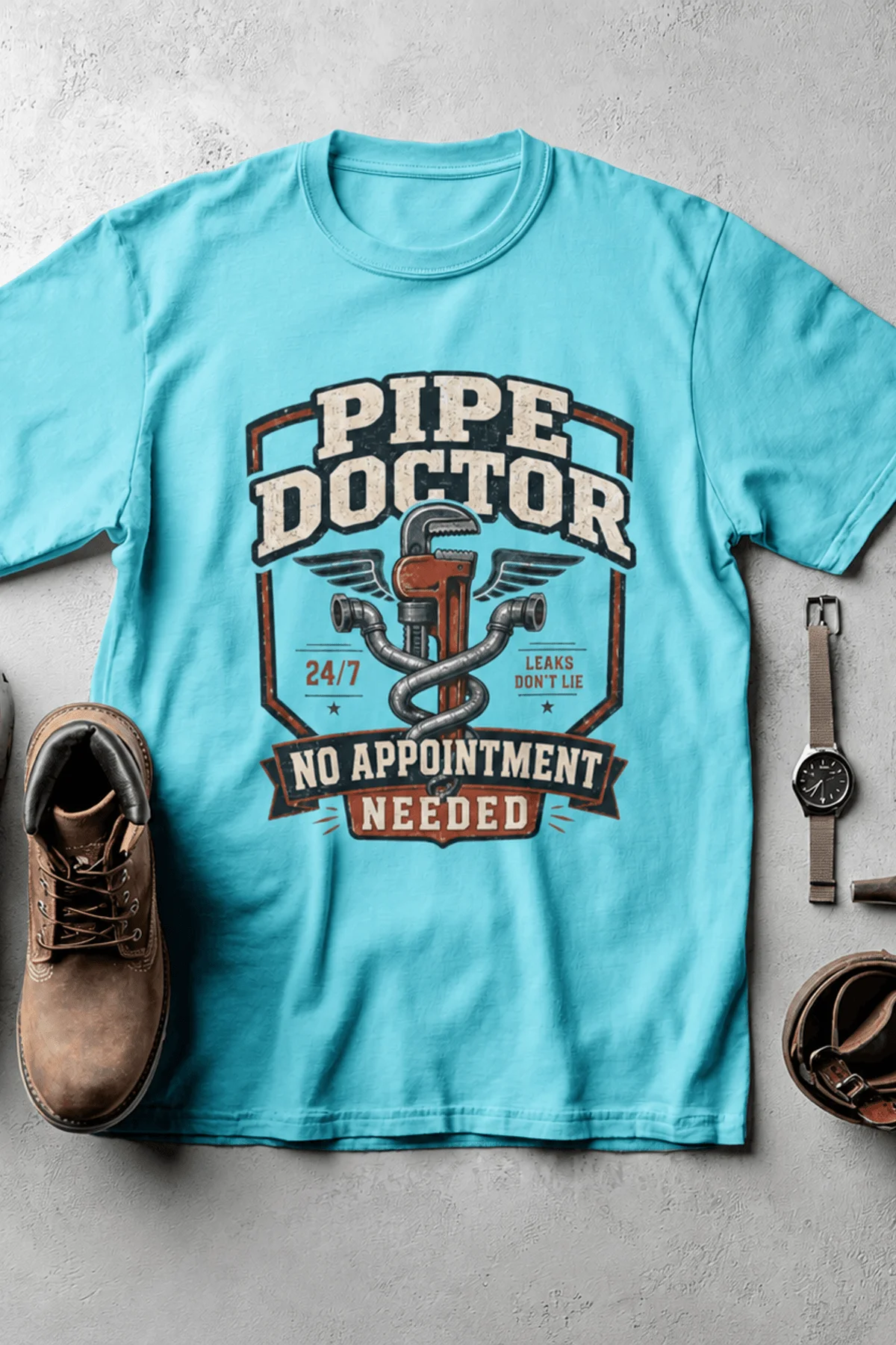 Plumber T-Shirt — "Pipe Doctor. No Appointment Needed" Vintage Work Shirt — lagoon-blue — Flat-lay Plumber T-Shirt — "Pipe Doctor. No Appointment Needed" Vintage Work Shirt — lagoon-blue t-shirt, flat-lay product photo | Pressure Tested Co