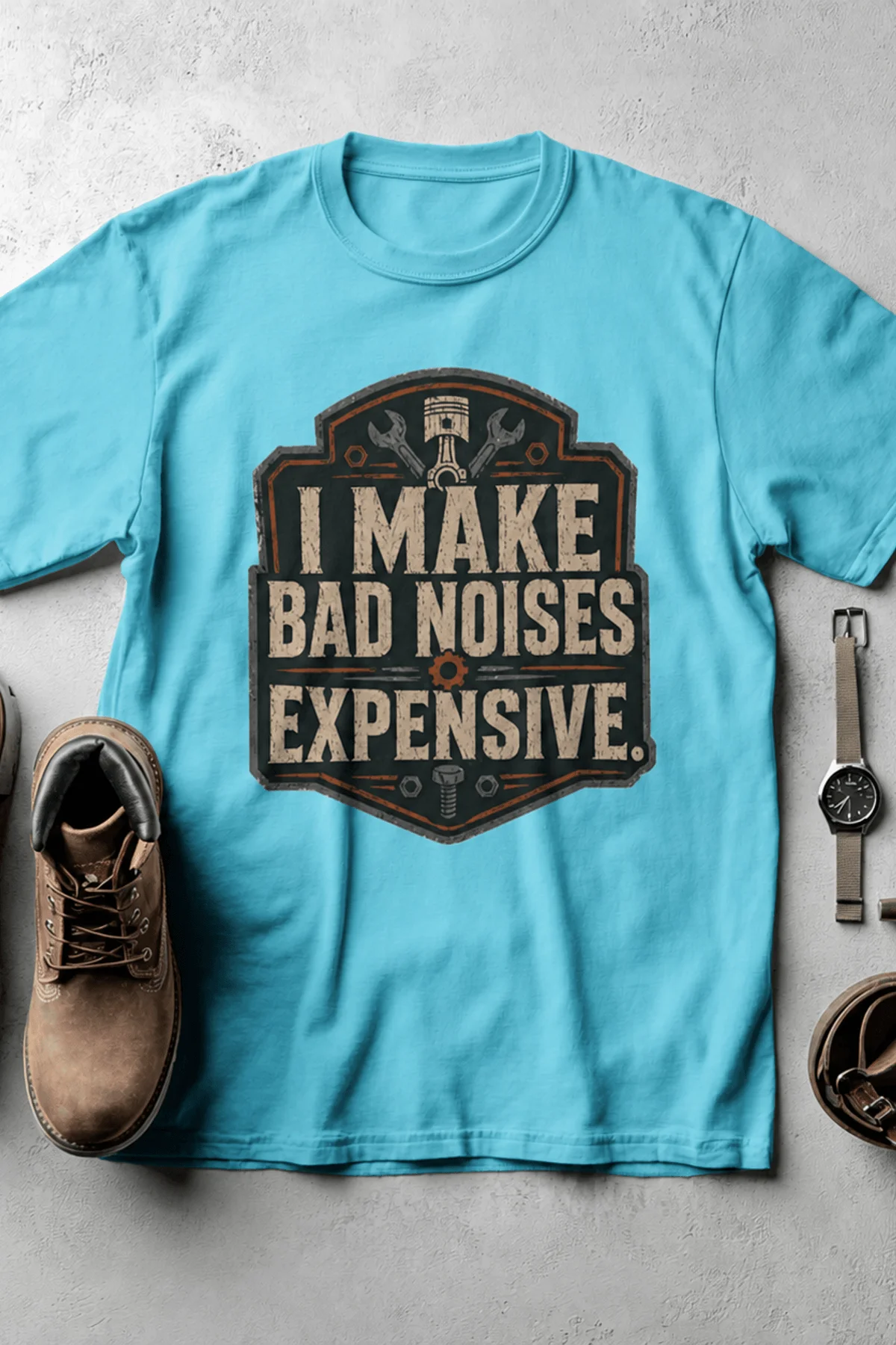Funny Mechanic Tee - "I Make Bad Noises Expensive" Technician Worker/ Mechanic / Gearhead Tee — lagoon-blue t-shirt, flat-lay product photo | Pressure Tested Co