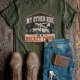Bucket Truck T-Shirt - “My Other Ride Is A Bucket Truck” Utility Crew/Electrician Tee — military-green t-shirt, flat-lay product photo | Pressure Tested Co