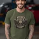 Wrench First Tee — "Wrench First, Questions Later" Mechanic Skull T-Shirt — military-green t-shirt, model photo | Pressure Tested Co