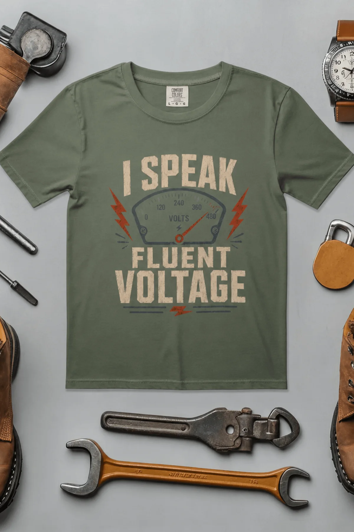 I Speak Fluent Voltage T-Shirt — Electrician & Electronics Tech Gift — moss t-shirt, flat-lay product photo | Pressure Tested Co