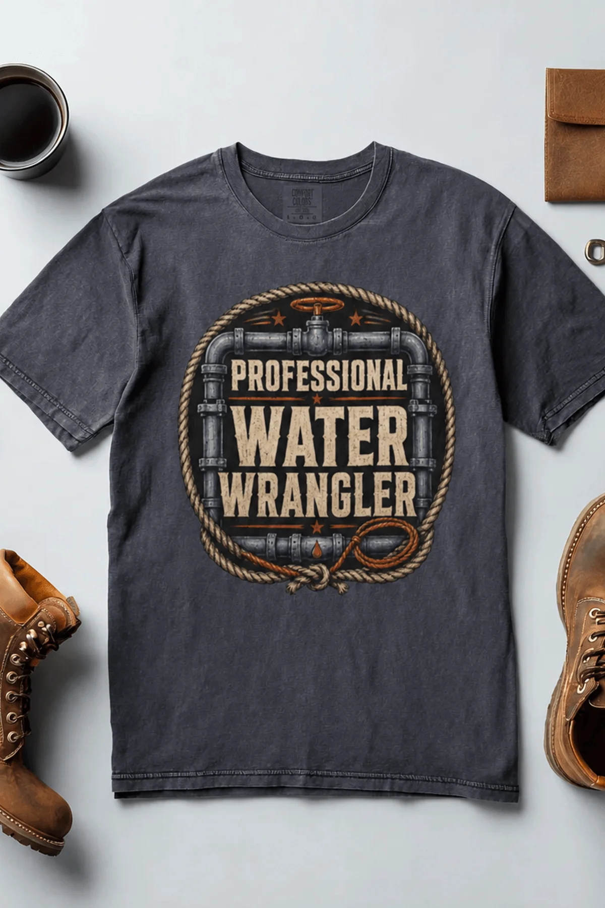 Funny Plumber Tee - "Professional Water Wrangler" Rustic Rope Graphic T-Shirt — navy t-shirt, flat-lay product photo | Pressure Tested Co