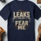 Leaks Fear Me T-Shirt - Funny Plumber Pipes Tee — navy t-shirt, flat-lay product photo | Pressure Tested Co
