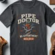 Plumber T-Shirt — "Pipe Doctor. No Appointment Needed" Vintage Work Shirt — navy — Flat-lay Plumber T-Shirt — "Pipe Doctor. No Appointment Needed" Vintage Work Shirt — navy t-shirt, flat-lay product photo | Pressure Tested Co