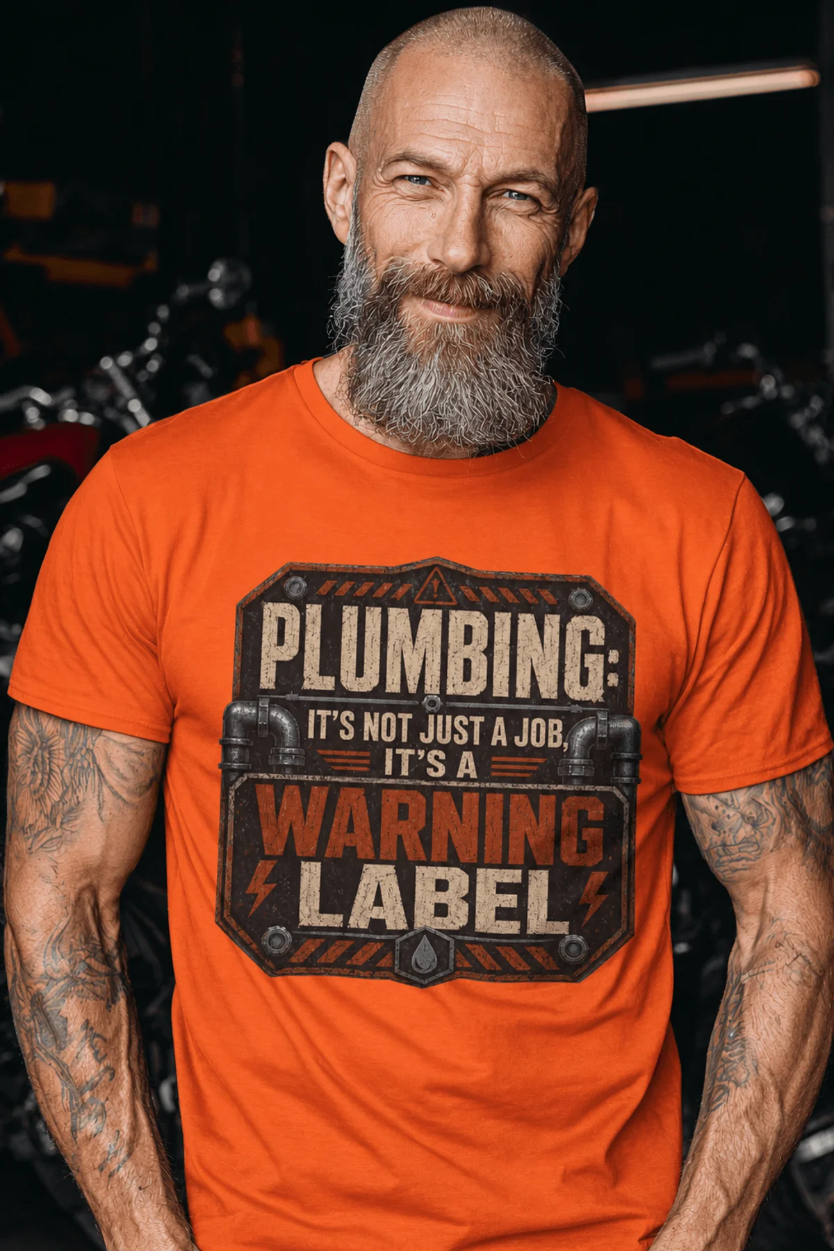 Plumbing Warning Label T-Shirt — Funny Plumber Shirt — orange t-shirt, model photo | Pressure Tested Co