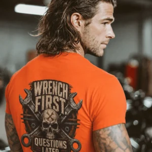 Wrench First Tee — "Wrench First, Questions Later" Mechanic Skull T-Shirt — orange t-shirt, model photo | Pressure Tested Co